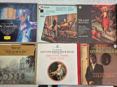 a lot of music books that are on a table