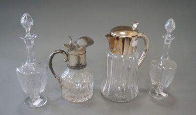 three glass and silver vases and a silver topper