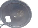 a black plate with a coin on it sitting on a table