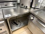 two ovens on the counter in the kitchen
