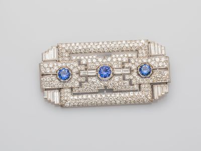 an art deco broochle with blue and white stones