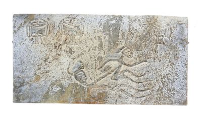 a stone carving of a man and a woman on a horse