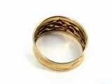 an image of a close up of a gold ring on a white surface
