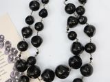 necklace with black beads and a broochi broochi broochi broochi broochi broochi broochi broochi