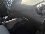 a car dashboard with a steering wheel and a control panel