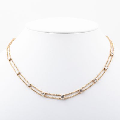 a gold chain necklace with a star pendant and a star charm