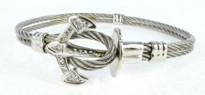 a close up of a bracelet with an anchor on it
