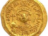 une pièce d'or portant l'image d'un homme