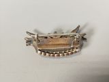 sterling silver broochle with spikes and spikes on it