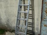 a ladder leaning up against a wall next to a door