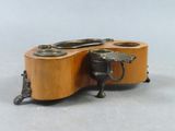 a small wooden box with two cups on it