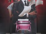 l'affiche du film « Populaire », sur laquelle figurent un homme et une femme