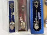 a lot of silver spoons and spoon spoons in a box
