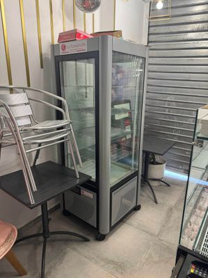 an image of a refrigerator and a chair in a room