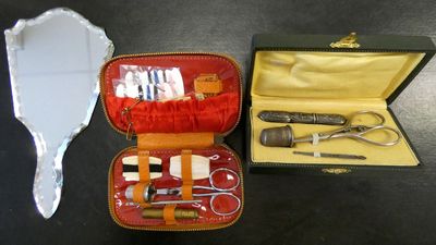 a case with scissors, scissors, and other items in it