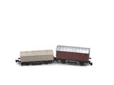 a toy train on the tracks with a white background