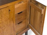 a wooden cabinet with a door open on a white background