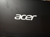 a close up of a laptop with the acer logo on it
