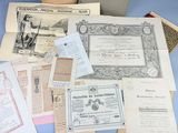 a pile of old papers on a blue table