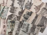 a lot of old postcards sitting on a table