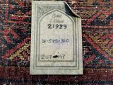 a close up of a tag on a rug with a tag attached to it