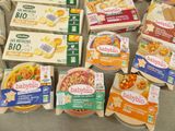 several boxes of babyloo cheese sitting on a table next to a box of babyloo cheese