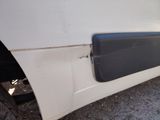 a close up of a car door with the door handle missing