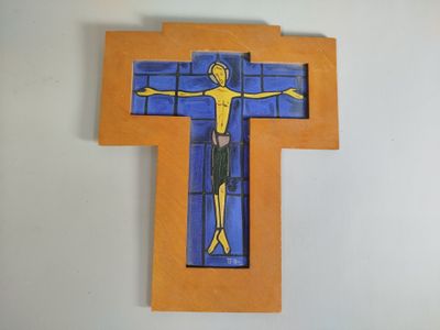 a cross made out of paper with a man on it