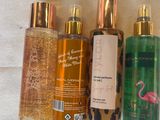 Quatre types différents de produits de soins du corps sont alignés sur une table
