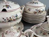 many plates and cups and saucers on the table