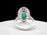 an image of a ring with a turquoise stone in the center