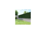 a picture of a large green hedge next to a road