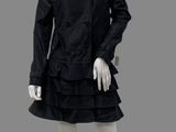 an image of a mannequin wearing a black dress and coat