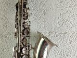 a saxophone that is sitting on a shelf