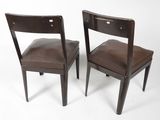 pair of brown leather chairs on white background with white background