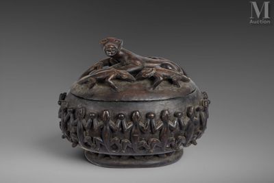 an image of a bronze box with figures on top of it