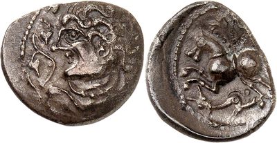 a silver coin with an image of a man and a woman on it