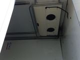 a picture of a door in a building with a light on