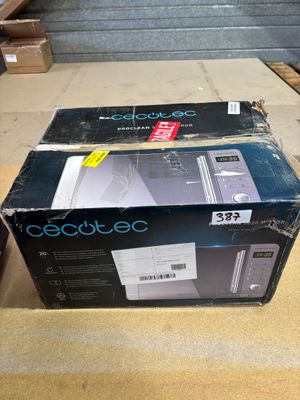 two boxes of electronic equipment sitting on top of a wooden table