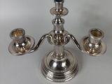 an image of a silver candle holder on a table