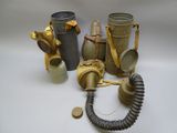 many different types of gas masks on a white surface