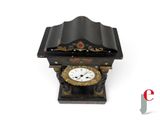 a small clock that is sitting on a table