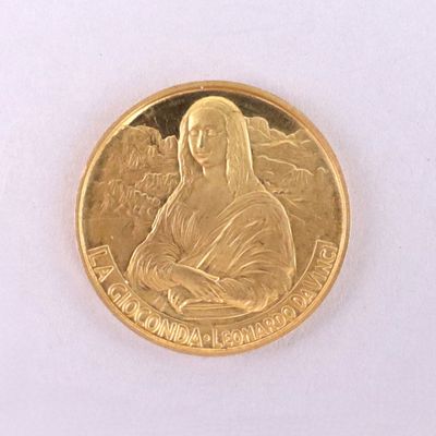 gold coin with a picture of the virgin of guadalupe on it