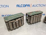 three old batteries sitting on top of a table next to each other
