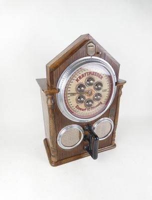 a wooden clock that is on display on a table