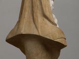marble bust of a woman wearing a veil on a pedestal