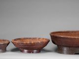 three bowls and a bowl on a table with a gray background