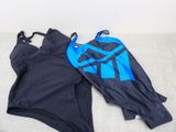 two swimsuits are laying on the floor next to each other