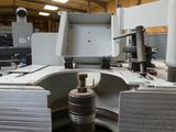 an image of a machine that is working on a piece of paper