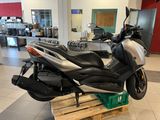 a motorcycle that is sitting on a pallet in a showroom